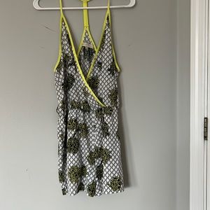 Neon, yellow, black, and white flower romper